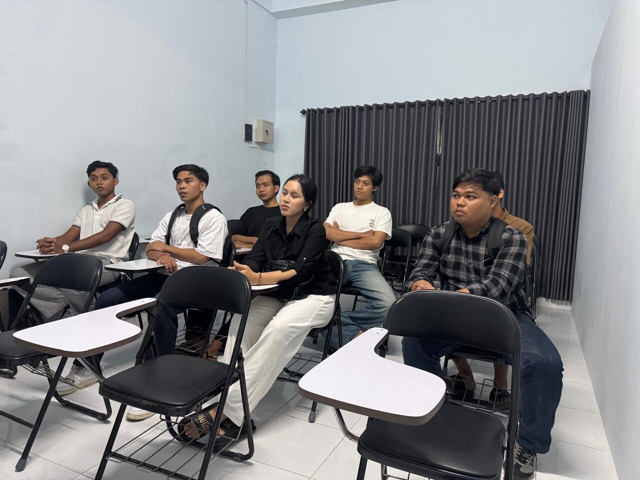 Candidates listening to a pre-placement briefing