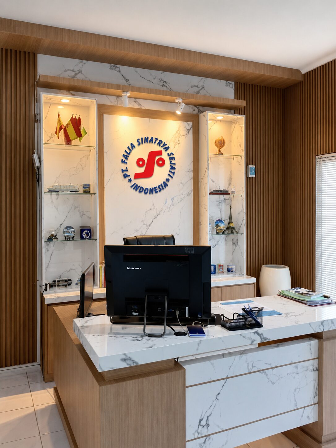 Reception desk at the Bali Branch Office featuring the PT Falia Sinatrya Sejati emblem